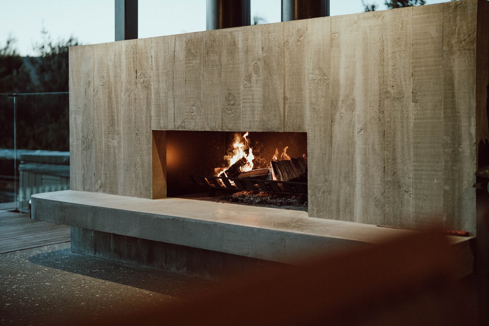 Mangawhai Heads outdoor living - fireside lounge beside the pool